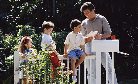 Family Outdoors Getting Their Mail