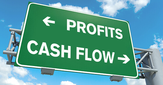 Freeway Sign With Profits Headed To The ;left And Cash Flow Headed To The Right