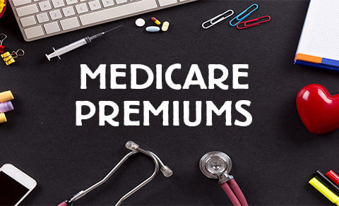 "medicare Premiums" Surrounded By Keyboard, Stethoscope, Prescription