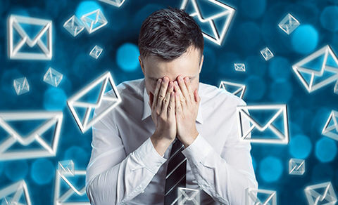 Man Holding His Face Surrounded By Symbols Representing Email