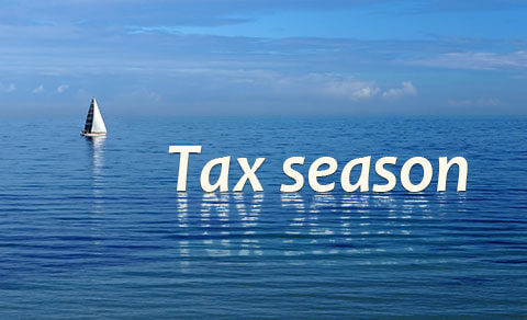 Sail Boat On The Ocean With Tax Season Written Across The Image