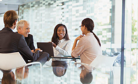 Group Of Professional In An Office Having A Meeting