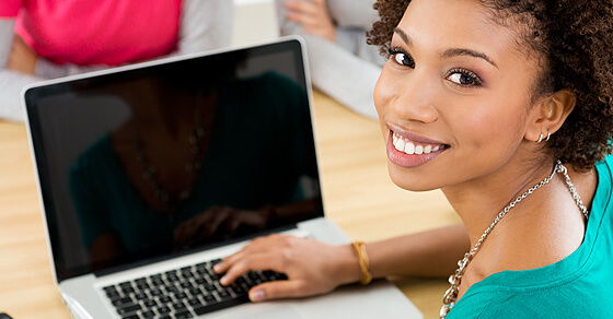 Woman With A Laptop In A Classroom
