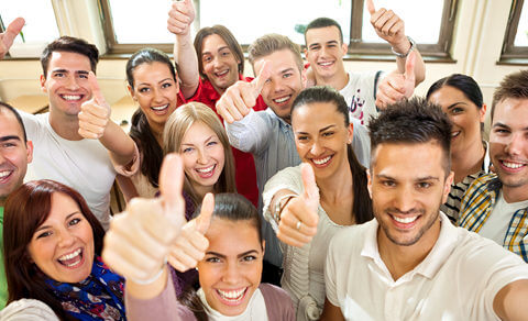 Classroom Filled With College Students Giving Thumbs Up Sign