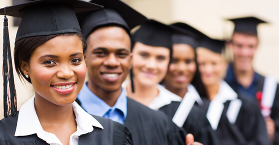 College Graduates In A Row With Their Diplomas