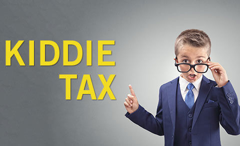 Child In A Blue Suit Wearing Glasses Poitig At The Words Kiddie Tax