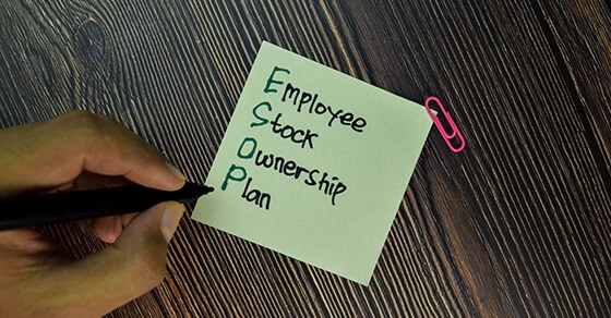 Esop Employee Stock Ownership Plan Write On Sticky Note Isolated On Wooden Table. Business Concept