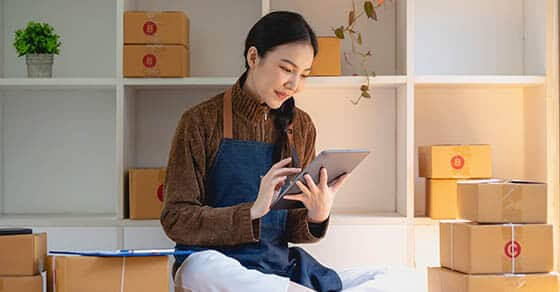 Beautiful Business Woman Owner Selling Online Using Tablet To Chat With Customer.