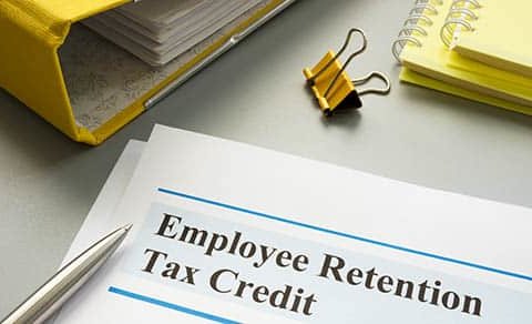 Employee Retention Tax Credit Papers And Folder.