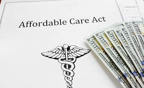 Affordable,care,act,insurance,papers,with,cash