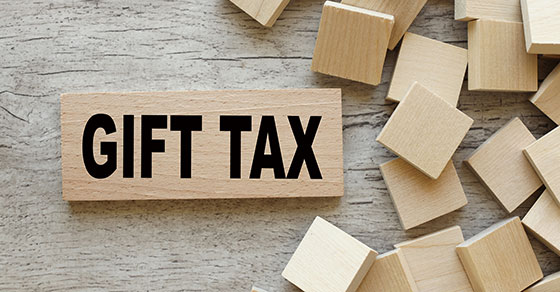 Wood blocks on a desk with the words Gift Tax written on one block