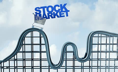 Illustration of a roller coaster with a shopping cart on it carrying the words STOCK MARKET