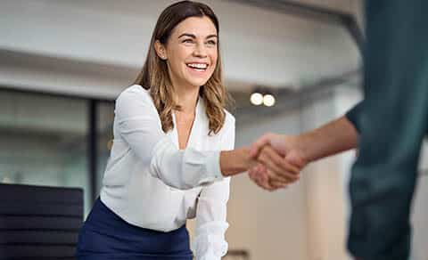 Happy,mid,aged,business,woman,manager,handshaking,greeting,client,in
