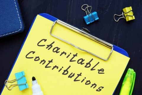 Business Concept About Charitable Contributions With Sign On The Page.