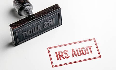 Rubber,stamping,that,says,'irs,audit'.