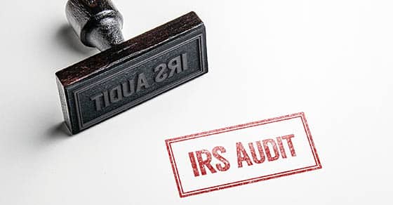 Rubber,stamping,that,says,'irs,audit'.