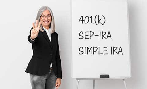 Middle,age,white,hair,woman,smiling,and,looking,friendly,,showing, three, options, 401k, SEP-IRA, Simple, IRA