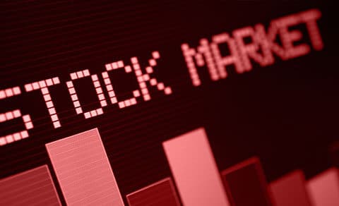 The image shows **"STOCK, MARKET"** in bold, red, text, with, bar, charts, symbolizing, a, market, downturn.