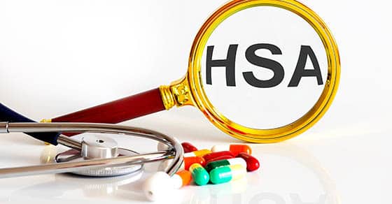 Magnifying,lens,with,text,hsa,with,medical,tools,pills