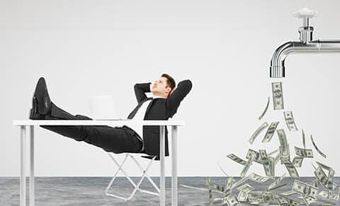 Businessman,resting,on,a,chair,and,faucet,from,which,the