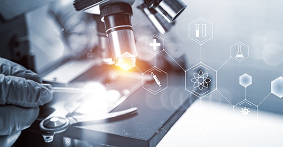 A, close-up, of, a, microscope, being, used, in, a, laboratory, setting, with, a, gloved, hand, adjusting, the, microscope, highlighting, a, research, or, scientific, environment. Overlaying, the, image, are, various, science, and, technology, icons, including, symbols, for, health, chemistry, DNA, and, innovation, which, emphasize, research, medical, and, technological, advancements. The, lighting, effect, under, the, microscope, lens, draws, attention, to, active, scientific, exploration.