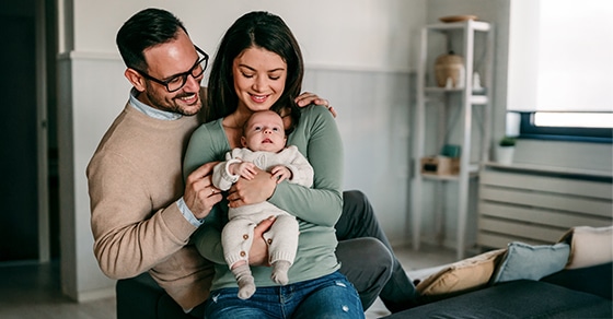 Based, on, the, image, of, a, smiling, couple, holding, their, baby, in, a, cozy, home, setting,, the, article, it, accompanies, likely, falls, into, one, or, more, of, the, following, categories,