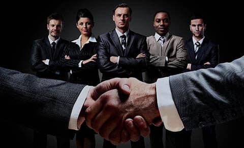 Handshake,on,the,background,group,of,business,people.