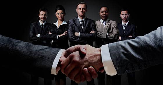 Handshake,on,the,background,group,of,business,people.