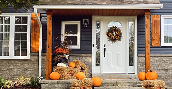 The 2025 SALT deduction cap increase might save you substantial taxes Front porch, fall decor, pumpkins, hay bales, wreath, white door, cozy home, autumn vibes.