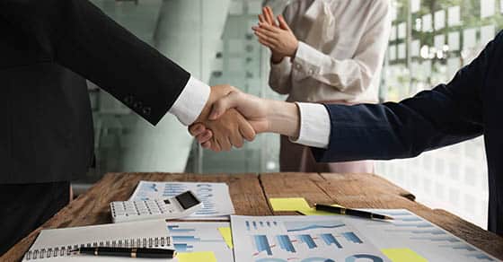 How will taxes affect your merger or acquisition? Business,people,shaking,hands,,finishing,up,meeting.,business,merger,and