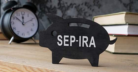Wooden,piggy,bank,with,sep,ira,inscription,on,the,side.